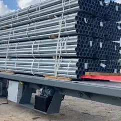 Metal tube unloading from container