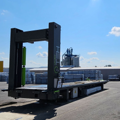 Automated container loader integrated into facility