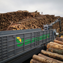 Log loading system on tracks
